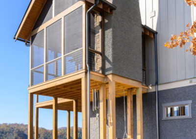 Miller Residence Exterior screened porch with fireplace