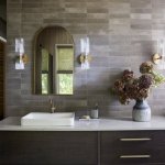 idology-–-casa-bonita-–-sprout-–-hendersonville-nc-–-custom-home-–-bathroom-vanity-arched-mirror-brass-sconces-–-02
