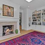 id-ology-–-the-arboretum-garden-house-–-biltmore-forest-–-asheville-nc-–-renovation-–-living-room-fireplace-built-in-bookshelves-colorful-rug-–-05